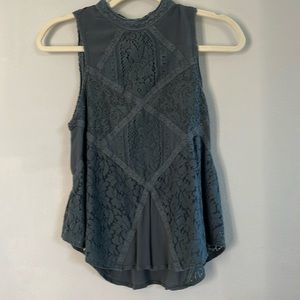 Women’s sleeveless top with lace detail. Color sage, size S